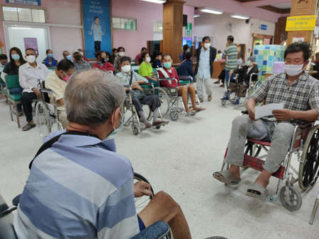 CHIANG RAI, THAILAND - MARCH 23 : Unidentified asian patients wearing hygienic mask in Phan hospital during the spread of Covid-19 virus on March 23, 2020 in Chiang Rai, Thailand.のeditorial素材