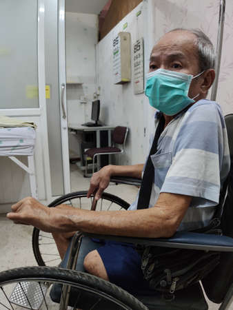 CHIANG RAI, THAILAND - MARCH 23 : Unidentified asian patients using hygienic mask in Phan hospital during the spread of Covid-19 virus on March 23, 2020 in Chiang Rai, Thailand.のeditorial素材