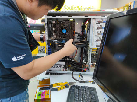 CHIANG RAI, THAILAND - JUNE 9 : Unidentified repairman working with big graphic card on June 9, 2020 in Chiang Rai, Thailand.のeditorial素材