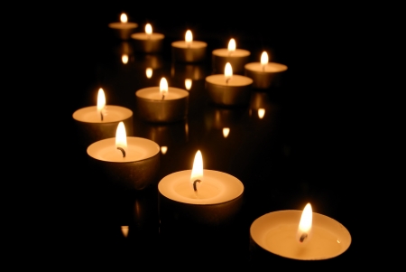 Burning candles  focus on front candle  の写真素材