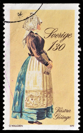 SWEDEN - CIRCA 1979: A stamp printed in SWEDEN shows traditional clothing circa 1979のeditorial素材