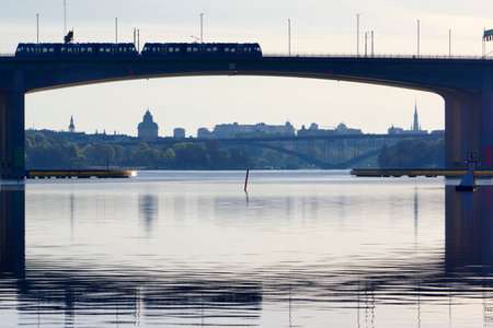 Summer day in Stockholm. Tram over the bridge between Bromma and Essingen in Stockholmの写真素材