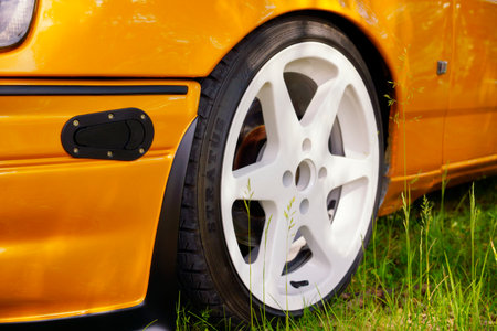 Close-up of the front wheel of a sports car.