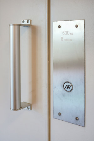 Elevator button on white wall. Elevator Button up and down direction with copy space
