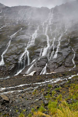 The many waterfalls during rain showers in New Zealandの写真素材