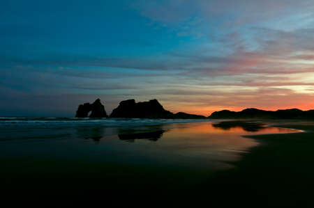 Golden morning at a beach with fiery sunriseの写真素材