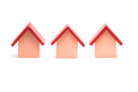 Small red roofed model house over white