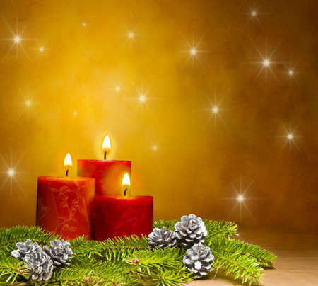 Three candles decorated in a festive Christmas decoration, with space for advertising text Three candles decorated in a festive Christmas decoration, with space for advertising text