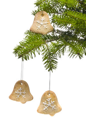 Tree bell shape cookies as Christmas tree decoration, over whiteの写真素材