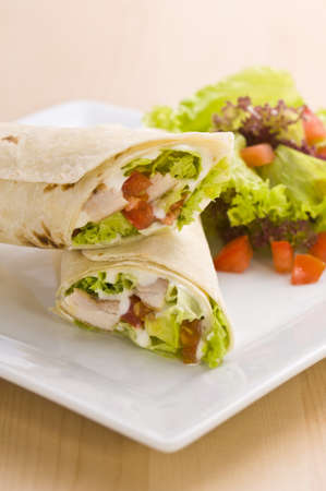 Two avocado wrap with a healthy side salad decoratedの写真素材