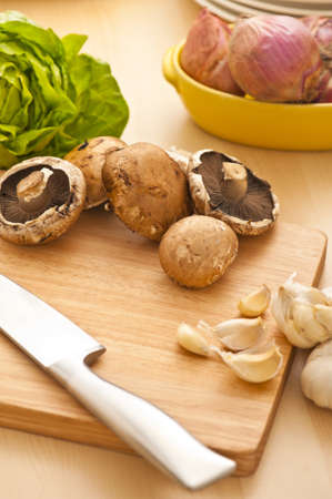 Vegetables on a chopping board, preparation for a saladの写真素材