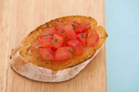 Prepared Bruschetta on a wooden board, close-up shoot