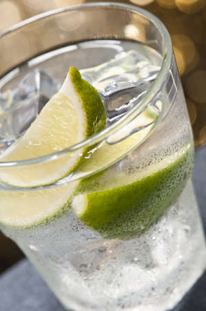 Caipiroska cocktail nice decorated in front of a colored backgroundの写真素材