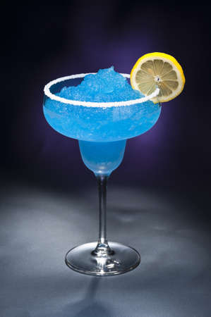 Blue margarita Cocktail in front of different colored backgroundsの写真素材