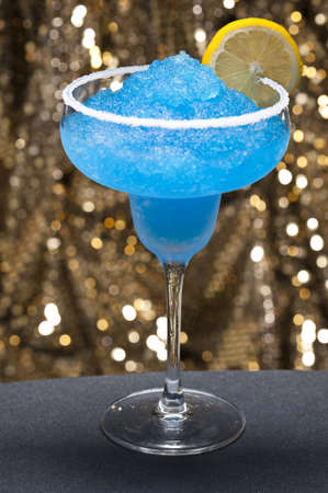 Blue margarita Cocktail in front of different colored backgroundsの写真素材