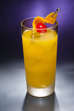 Harvey Wallbanger Cocktail in front of different colored backgroundsの写真素材