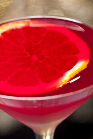 Negroni cocktail in front of different colored backgroundsの写真素材