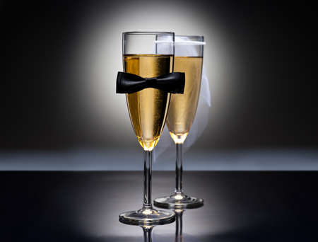 Champagne glasses with conceptual heterosexual decoration for straight couplesの写真素材