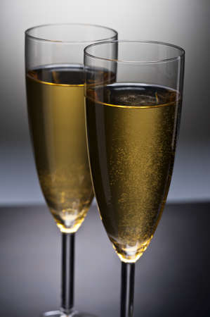Champagne glass in front of a spotlightの写真素材