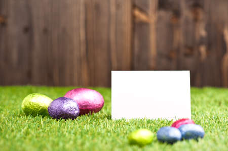 Chocolate Easter eggs in an outdoor setting with place cardの写真素材