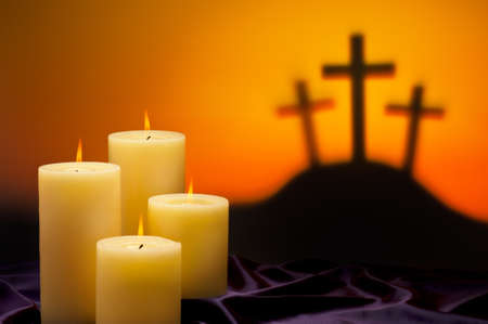 Three crosses symbolic for Jesus crucifixion in Golgotha and candles of hopeの写真素材