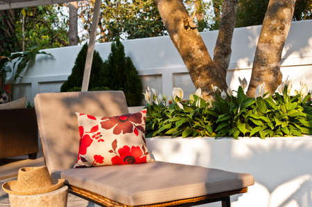 Villa garden with Sunlounger in the beautiful afternoon sun