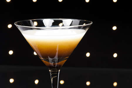 Coffee Martini cocktail in front of disco lights