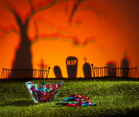 Halloween landscape with tree graveyard and sweetsの写真素材