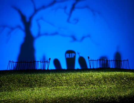 Halloween colorful landscape with tree and graveyardの写真素材