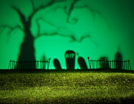 Halloween colorful landscape with tree and graveyardの写真素材