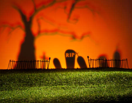 Halloween colorful landscape with tree and graveyardの写真素材