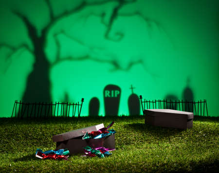 Halloween landscape with tree graveyard and sweetsの写真素材