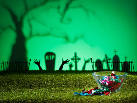 Halloween landscape with tree graveyard and sweetsの写真素材