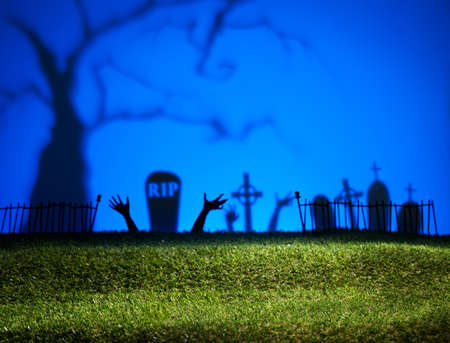 Halloween landscape with tree graveyard and green grassの写真素材