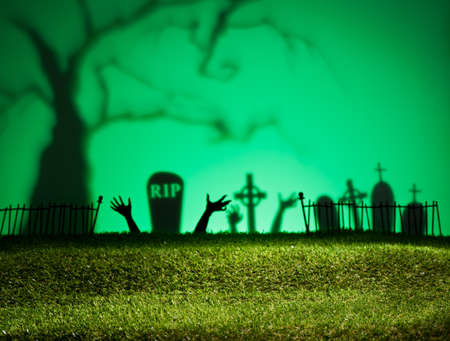 Halloween landscape with tree graveyard and green grassの写真素材