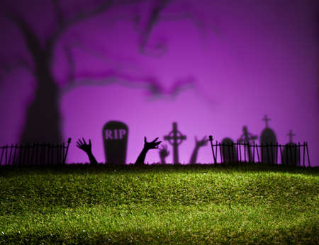 Halloween landscape with tree graveyard and green grassの写真素材