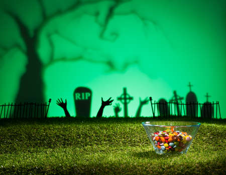 Zombie hands of a graveyard catching the sweetsの写真素材
