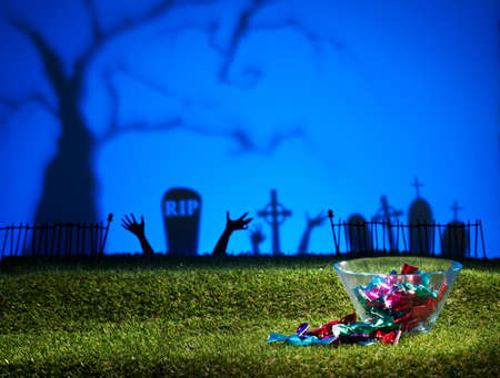 Zombie hands of a graveyard catching the sweetsの写真素材