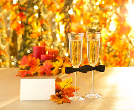 Champagne glasses with conceptual same sex decoration for gay men with place cardの写真素材