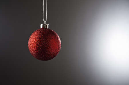 Christmas Bauble in simple color setting and side lighting の写真素材
