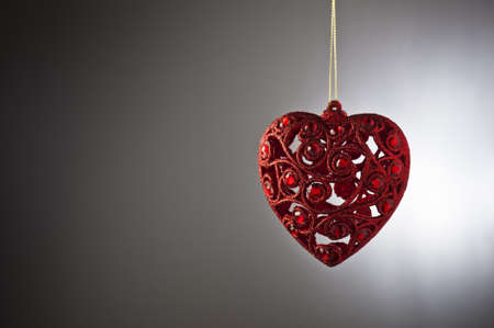 Christmas tree ornament in from of a heartの写真素材