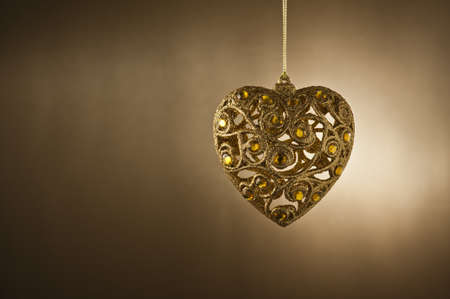 Christmas tree ornament in from of a heartの写真素材