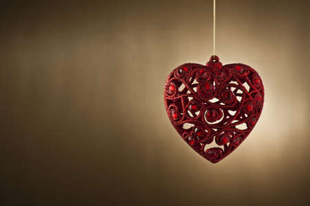 Christmas tree ornament in from of a heartの写真素材