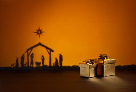 Birth Jesus silhouette of the crib in Bethlehem with presentの写真素材