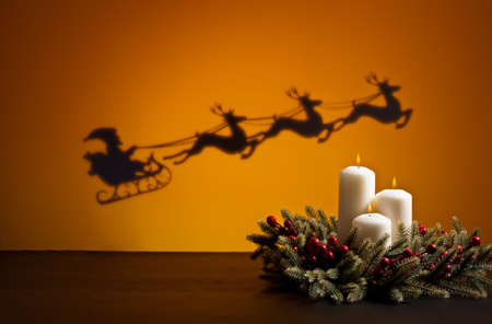 Santas sledge on his way to deliver presents and candlesの写真素材