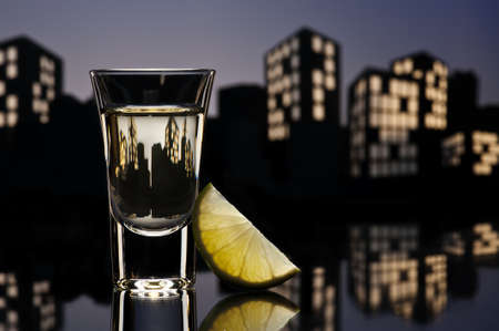 Tequila shoot in colorfull cityscape settingの写真素材