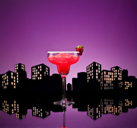 Metropolis strawberry Margarita  cocktail in city skyline settingの写真素材