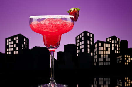 Metropolis strawberry Margarita  cocktail in city skyline settingの写真素材