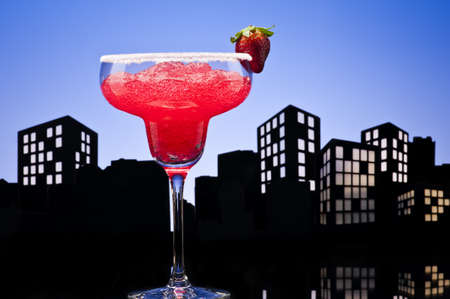 Metropolis strawberry Margarita  cocktail in city skyline settingの写真素材
