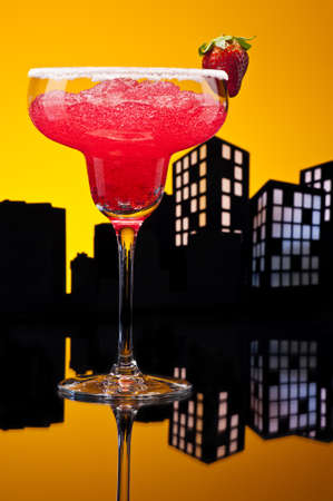 Metropolis strawberry Margarita  cocktail in city skyline settingの写真素材
